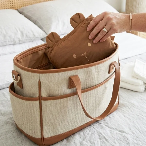 tapis à langer nomade imperméable ourson caramel en coton bio et pvc fermeture facile élastique