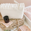 Bac de rangement à couches en tissu écru motif étoiles, planètes et fusée avec petites ailes en relief, coton bio