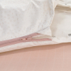 gigoteuse hiver fille rose pâle motif arc-en-ciel licorne manches amovibles tog 2,5 en coton bio oekoetex