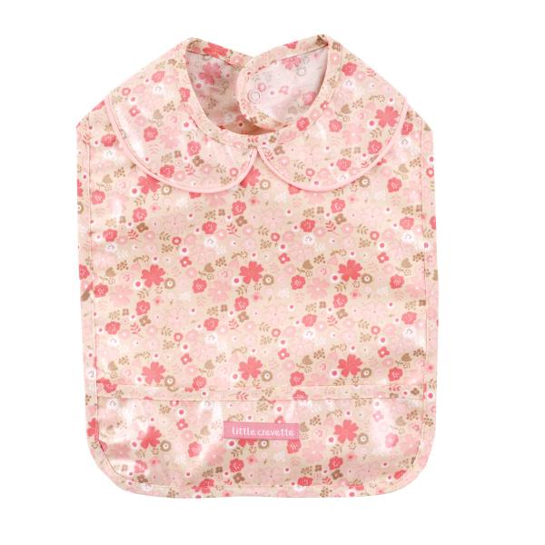 Bavoir enduit pvc fille motif fleur rose oekotex avec ramasse miette