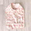 Bavoir enduit pvc fille motif fleur rose oekotex avec ramasse miette